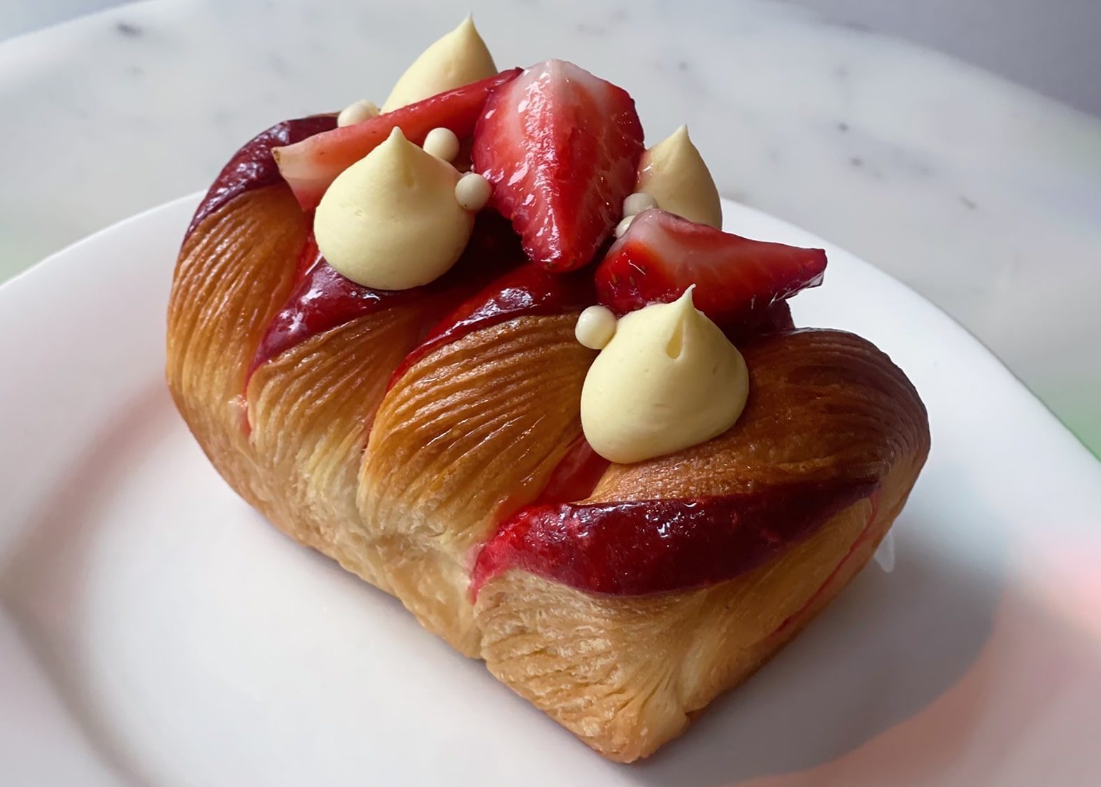 Edible-art-strawberry-min The strawberry pastry at Petit Pierre, like the rest of the bakery’s offerings, remains true to French techniques.